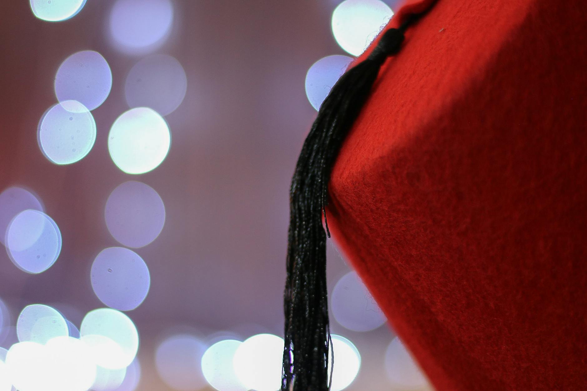 red chinese cap with black tassel